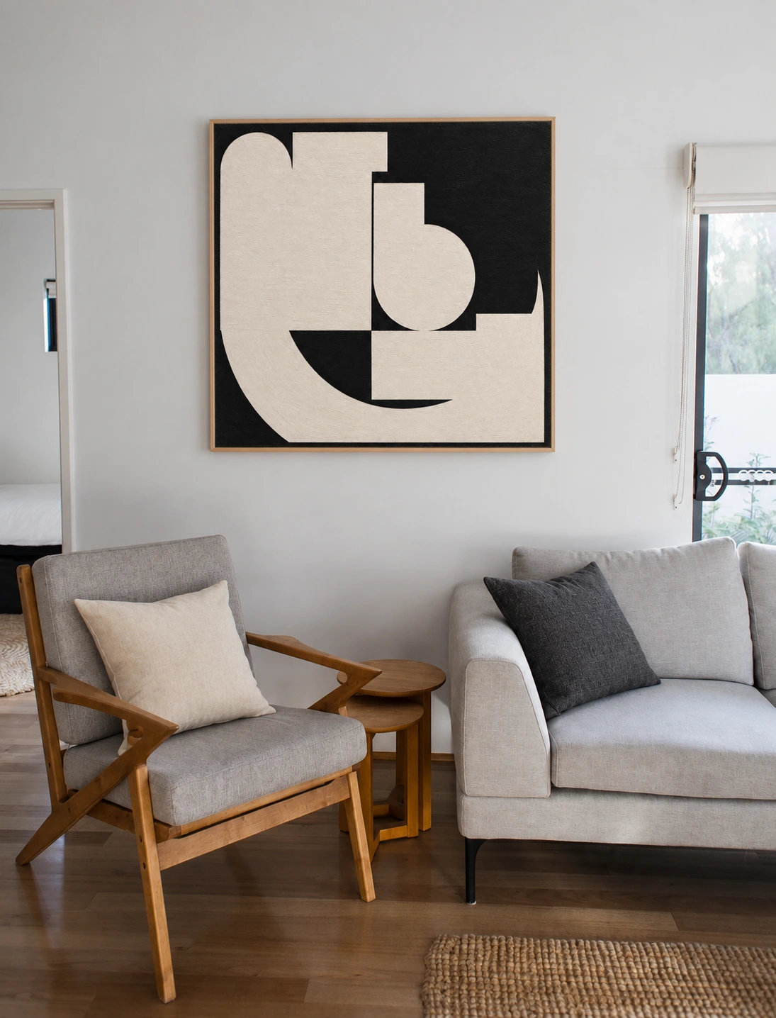 Courbe d’Ivoire — coin salon scandinave, cadre bois clair.